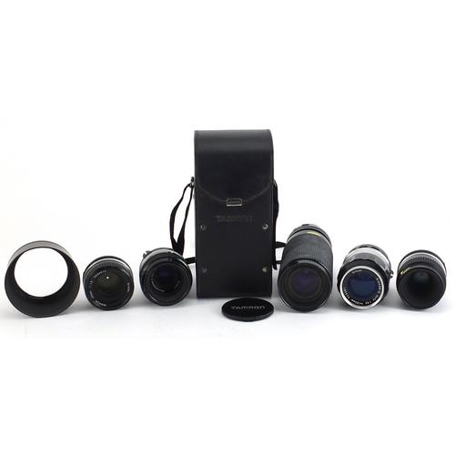 Five camera lenses comprising Tamron 60-300mm with case and four Nikon Nikkor 135mm, 55mm, 55mm and: Five camera lenses comprising Tamron 60-300mm with case and four Nikon Nikkor 135mm, 55mm, 55mm and 50mm