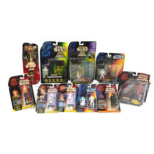 Star Wars action figures housed in sealed blister packs including episode 1 Qui-gon Jinn Pin Pop: Star Wars action figures housed in sealed blister packs including episode 1 Qui-gon Jinn Pin Pop candy and Deluxe Crowd Control Stormtrooper