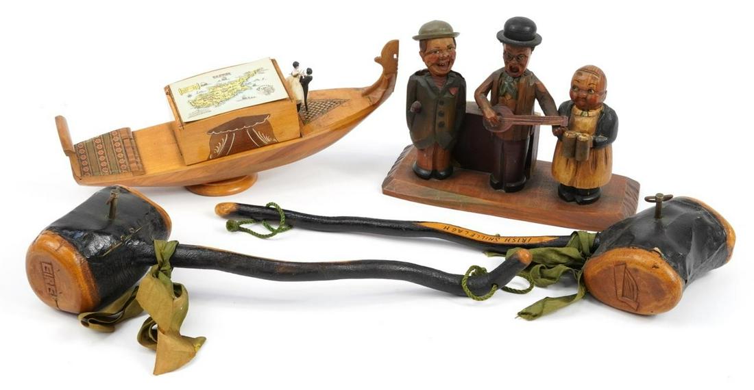 Musical woodenware including two Irish musical shillelaghs carved with harps, Sorento ware style: Musical woodenware including two Irish musical shillelaghs carved with harps, Sorento ware style musical cigarette dispenser in the form of a gondola and Black Forest musical figural bar companion wit