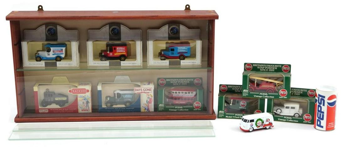 Diecast collector's vehicles arranged in a glazed wall hanging display case with glass shelves, the: Diecast collector's vehicles arranged in a glazed wall hanging display case with glass shelves, the display case 28.5cm H x 53cm W x 9cm D