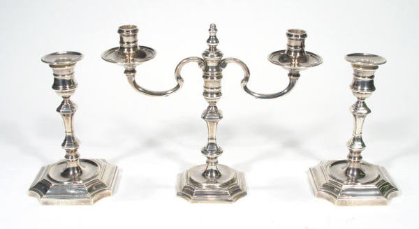 Silver two branch candelabra and a matched pair of: Silver two branch candelabra and a matched pair of candlesticks on octagonal bases, Birmingham 1964/68, 19cm high