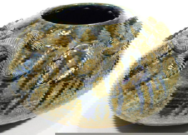 Eric Olsen Art pottery vase, relief moulded with l: Eric Olsen Art pottery vase, relief moulded with lizards and leaves under a green and blue mottled ground, impressed signature to the base, 27cm diameter