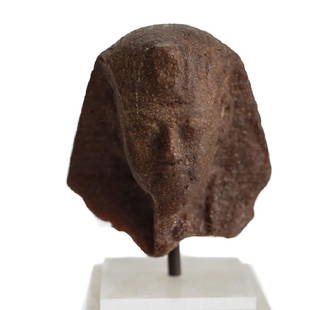 Egyptian Fragment Brown Quartzite head of a Man,: Egyptian Fragment Brown Quartzite head of a Man, possibly Tut-Ankh-Amun, mounted on plexi block with brass plaque (Tut-anch-amun 1347/46 - 1337/36 v. Chr.) 4.75" height total; bust only 2" height.