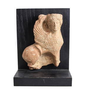 Archaic Grecco Roman Fragment Terra Cotta SPHINX Plaque: Archaic Grecco Roman Fragment Terra Cotta SPHINX Plaque figure, mounted on contemporary wood stand. Figure 5" x 7" x 1.75". 2.75lbs