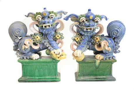 Pair of Chinese Shiwan Pottery Stoneware Foo Dogs: Pair of Chinese Shiwan Pottery Stoneware Foo Dogs, Blue and green glaze, 19th century, pipe form on back of figure, on rectangular base. 18Lbs. 12”height x 10”