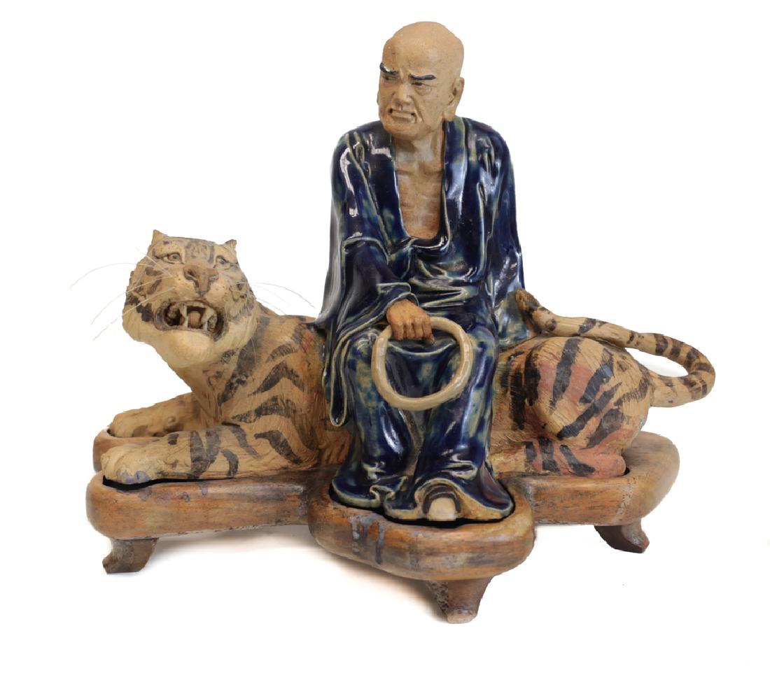Chinese Shiwan Pottery Stoneware Figurine, deity Luohan: Chinese Shiwan Pottery Stoneware Figurine, deity Luohan figure, Bintou / Lu Fuhu, 19th-20th century, Superb details, figure in blue glaze robe, holding a ring, seated on tiger. Potter's mark on inside