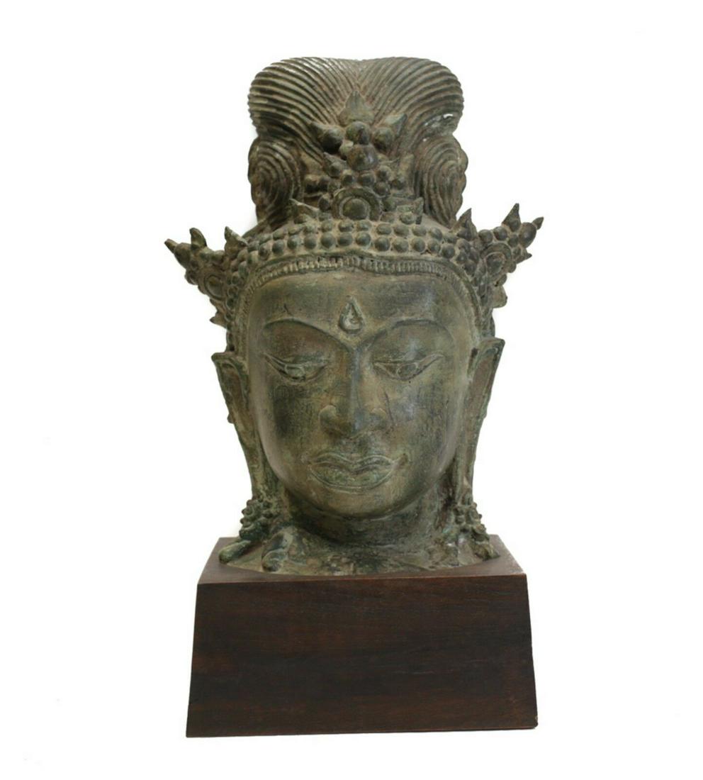 Large Bronze Head Fragment, Thai Buddhist Goddess, Tara: Large Bronze Head Fragment, Thai Buddhist Goddess, Tara / Guanyin. Eyes downcast, chignon style hair. Three pronged crown. Green patina. Mounted on wood plinth. 18lbs. Approx. Measurements: 13.5" heig
