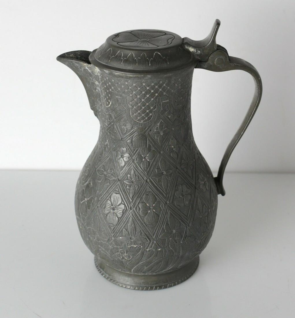 18-19th Century Rudot Mon Oudart Lille, France Pewter: 18-19th Century Rudot Mon Oudart Lille, France Pewter Covered Flagon Wine Jug / Pitcher. Finely engraved florals, touch mark on base. 2.75lbs Approx. Measurements: 8.25" height to lid. 4.5" diameter.