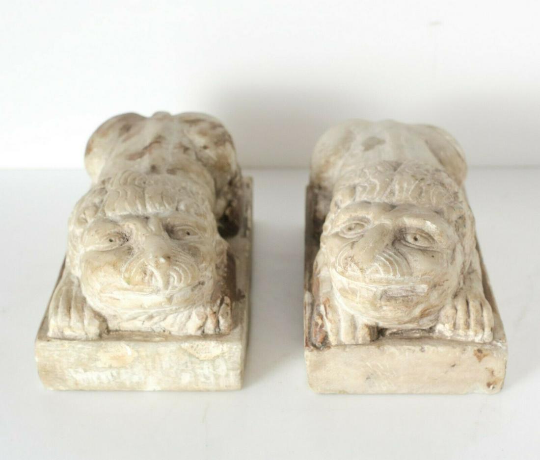 Hand Carved stone lions, likely Chinese, in a reclining (1 of 5)