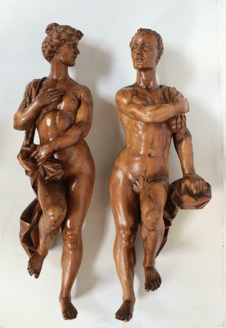Pair of Continental Classically Carved Wood Statues, Early 20th Century.: Pair of Continental Classically Carved Wood Statues, Nude man and woman. Early 20th Century. Weight Approx., 40 lbs Approx. Measurements: Man 32 inches height, female 33 inches. Domestic Shipping: $