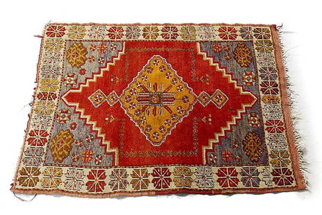 Turkish Wool & Cotton Rug c1900: A c1900 Handknotted Turkish rug made up of wool pile & cotton. Fringe is made up of cotton.c1900 Bright red-orange field, lavender, ivory, yellow geometric details. Cotton fringe. Measures Approx: