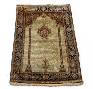 c1960 Persian Silk Prayer Rug: A c1960 Handknotted Persian silk prayer rug. Glossy pile - light green / ecru field, blue/black, silver, ocher. Floral and avian border, with Ram heads on columns, single urn, and chandelier