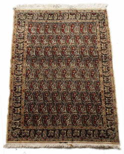 c1920 Signed Hereke Silk Prayer Rug: A c1920 hand woven Hereke silk prayer rug with metallic detail and white fringe. Repeating foliate design. Signed on lower border.Measures Approx: 64.5inches x 45inches: