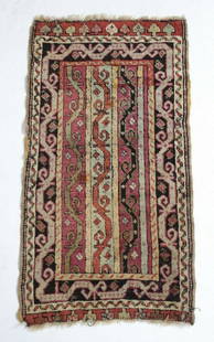 Antique 19th century Caucasian Small Throw Rug: A fine Antique 19th century Handknotted Caucasian Small Rug, geometric, wool pile, reds, greys, tans. Weight Approx., 2lbsMeasures Approx. 35inches w/out fringe x 19.25inches