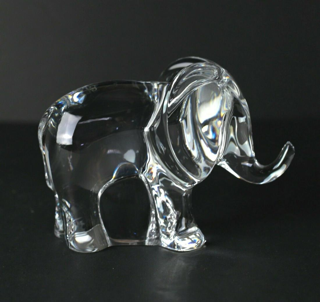 Baccarat LOET Vanderveen Art Glass Elephant figurine paperweight, trunk up: Baccarat LOET Vanderveen Elephant figurine / paperweight, trunk up Art Glass, elegant modern design. Makers mark, script mark and "LOET" mark 1lb Measures Approx. 3.125" height x 4.25" length x 2.5" w