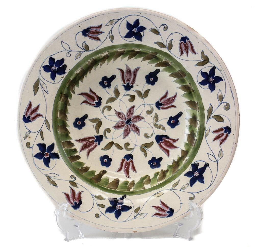 German Faience c1800 Rimmed Bowl, floral designs in plum deep blue olive green: German Faience c1800 Rimmed Bowl, floral designs in plum, deep blue, olive greens. Makers mark on reverse. From the estate of Hans Cohn. 1.75lbs From the estate of Hans Cohn, an investment banker and 