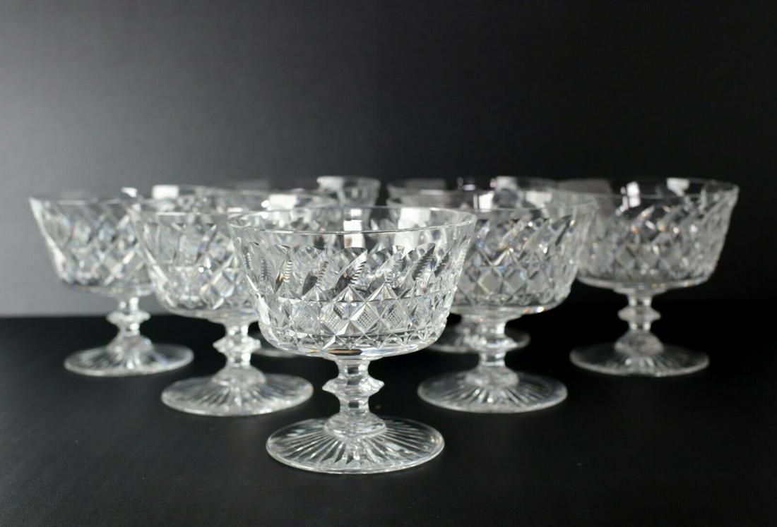 7pc Set of Thomas Webb Cut Glass Sherbet Compotes, cross hatch and leaf cuts: 7pc Set of Thomas Webb Cut Glass Sherbet Compotes, cross hatch and leaf cuts, c1950. Etched makers mark on base. 6.75lb Approx. Measurements: 4.375 in height x 4.5 in diameter at rim.Domestic Shipping