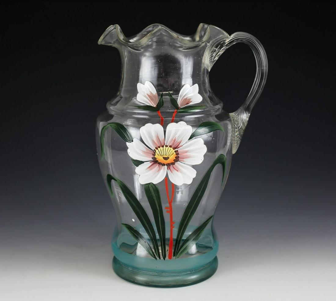 American Hand Blown Art Glass Pitcher, hand painted enamel flower, Mid century: American Hand Blown Art Glass Pitcher, hand painted enamel flower. Mid century Ruffled rim, reeded handle. 2lbs Approx. Measurements: 11" height x 7.5" spout to handle x 5.75" diameter.Domestic Shippi