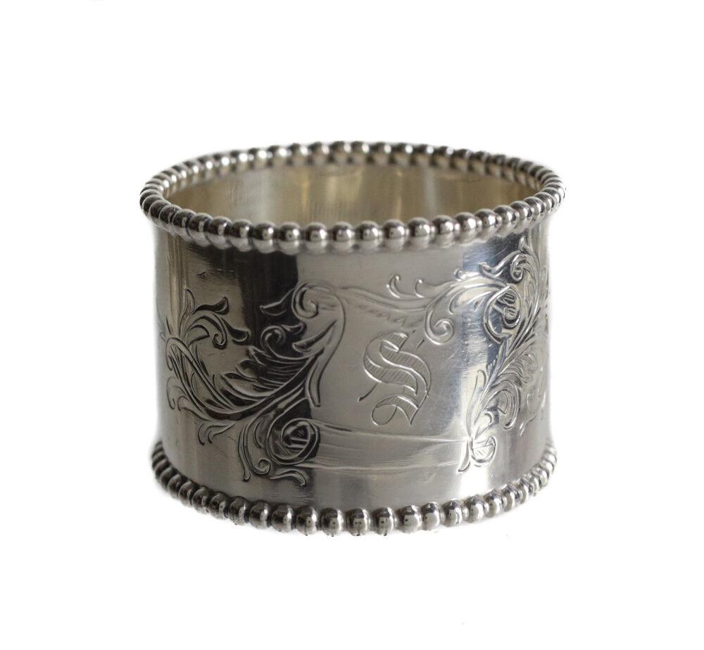 Towle Sterling Silver Napkin Ring, bead detail along rim, hand chased: Towle Sterling Silver Napkin Ring, bead detail along rim, hand chased paper scroll with monogrammed 'S". Makers mark and marked Sterling 574. 40gramsApprox. Measurements: 1.875" diameter x 1.375" heig