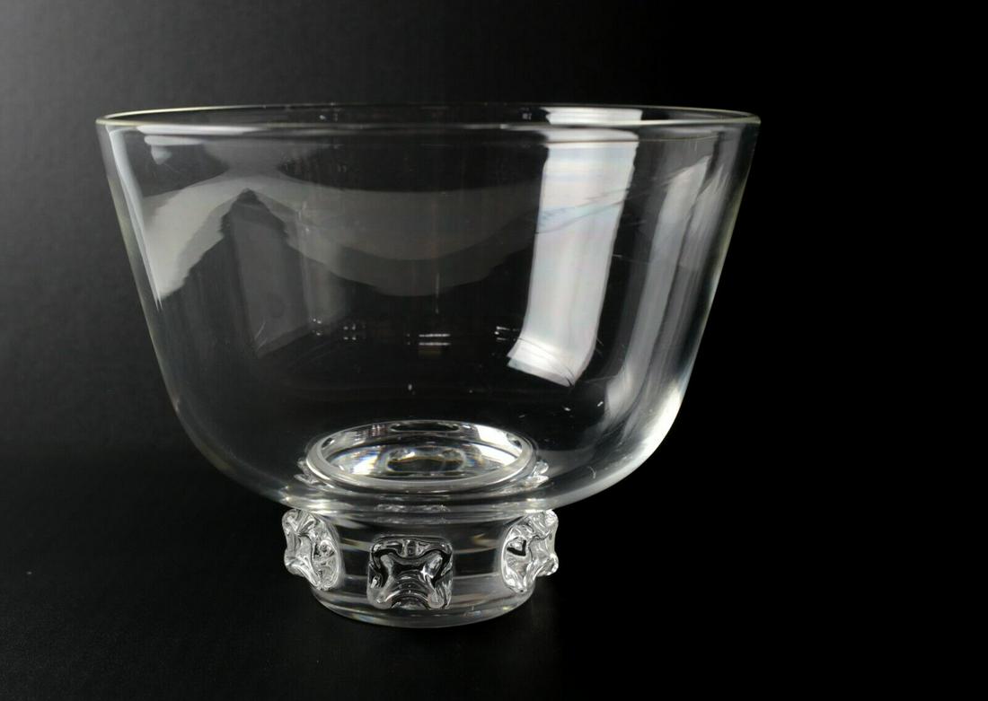 Steuben Art Footed pedestal Glass Bowl. Applied embellishments on the foot: Steuben Art Footed Glass Bowl. Applied embellishments on the foot. engraved makers mark 'Steuben' on base. Approx. Measurements: 9.125 in diameter x 7 inches height.Domestic Shipping: $30