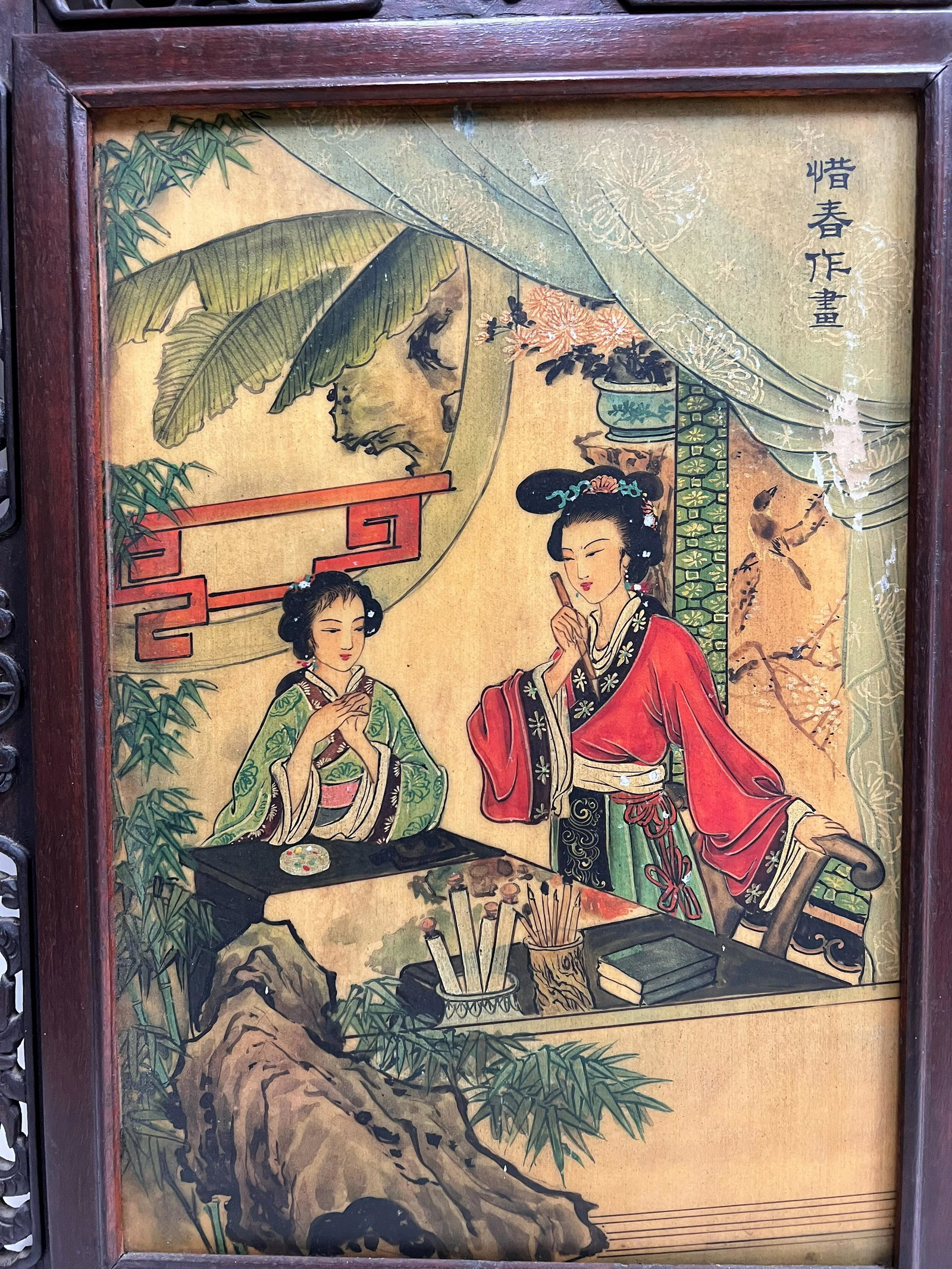 Two sided plaque in carved openwork frame: Two sided plaque in carved openwork frame. One one side, two ladies, one standing in front of a painting. 16.5 x 21.5 inches; image 10.25 x 15 inches
