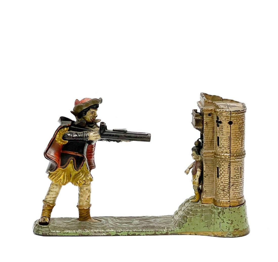 Early Example J & E Stevens William Tell Mechanical Bank Cold Painted Cast Iron: J&E Stevens cast iron cold painted William Tell mechanical bank, an early example. Bank depicts a man in a hat shooting at a apple on the head of a figure standing in front of a castle. Patented June 