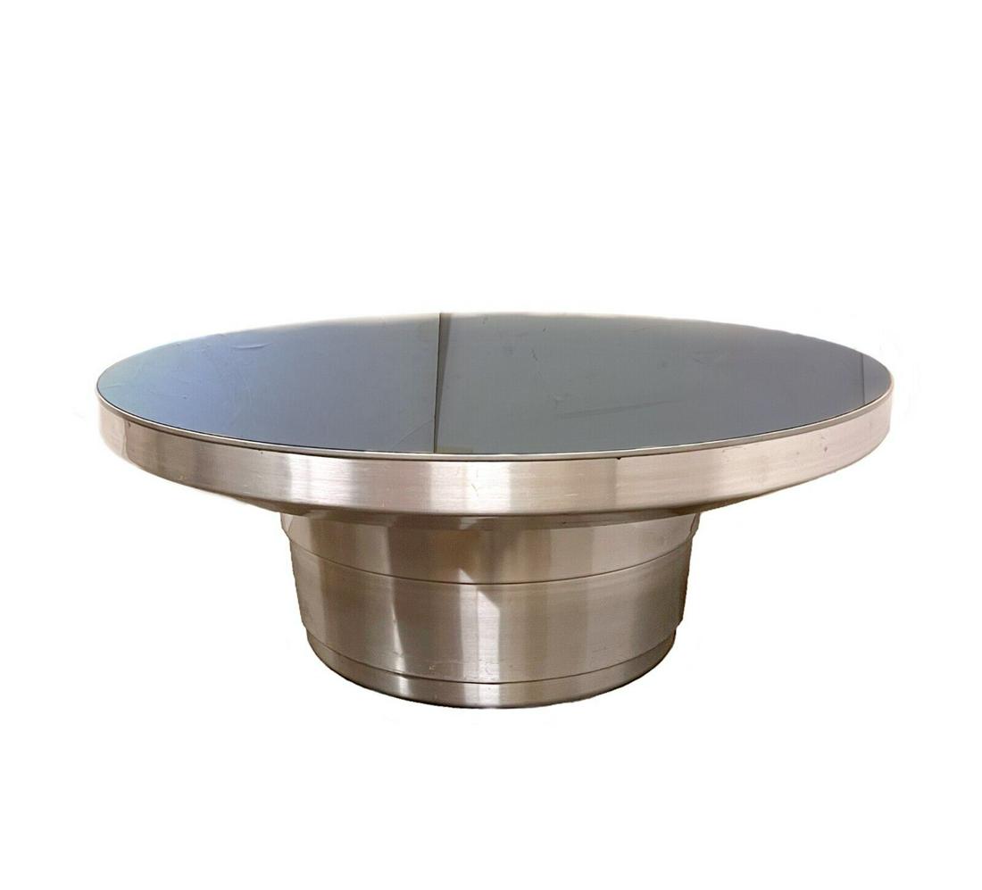 Aluminum pedestal and glass top coffee table (1 of 6)