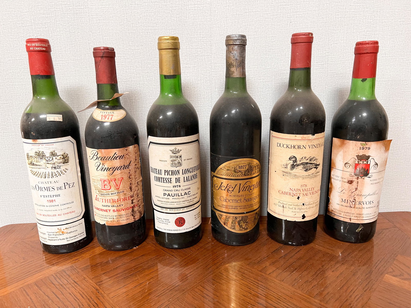 6 Vintage Estate Bottles of Wine Spirits Assorted: Les Ormes Pez 1981; Beaulieu Vineyard Cabernet Sauvignon 1977; Chateau Pichon Longueville Comtesse de Lalande 1978 Pauillac; Jekel Vineyard Cabernet Sauvignon 1977; Duckhorn Vinyard Cabernet Sauvignon