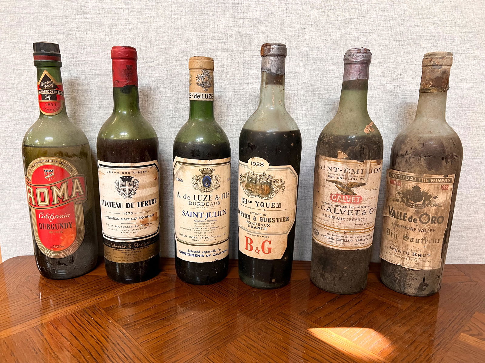 6 Vintage Estate Bottles of Wine Spirits Assorted: Roma Burgundy; Chateau du Tertre 1970; A. de Luze & Fils Saint Julien 1966; Barton & Guestier 1928; Saint Emilion J. Calvet & Cie; Wente Bros Valle de Oro 1938 Domestic Shipping: Please Inquire