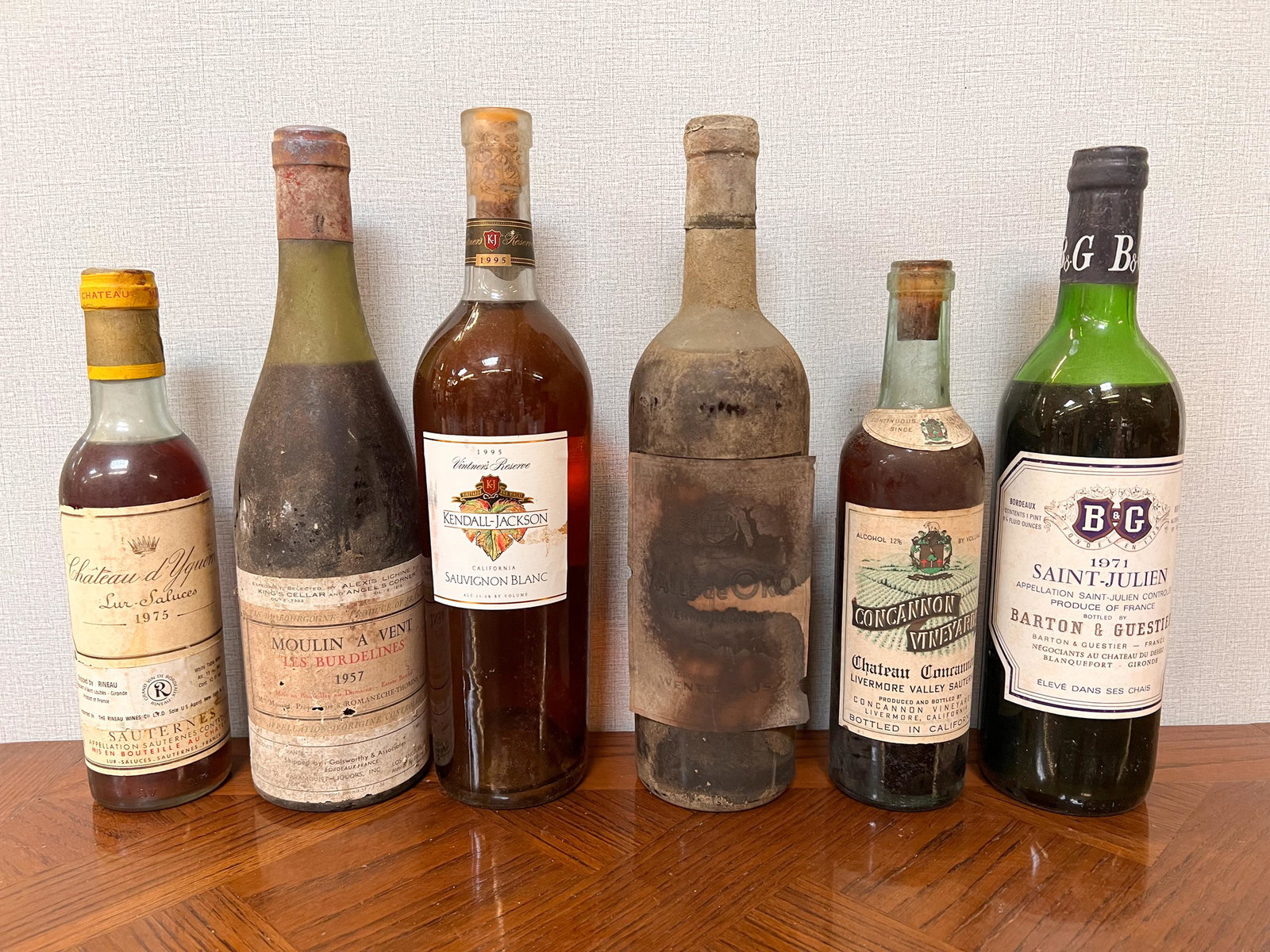 6 Vintage Estate Bottles of Wine Spirits Assorted: Chateau d' Yquem 1975; Moulin A Vent Les Burdelines 1957; Kendall Jackson 1995; Valle de Oro; Concannon Vinyards; Barton & Guestier Saint Julien 1971 Domestic Shipping: Please Inquire