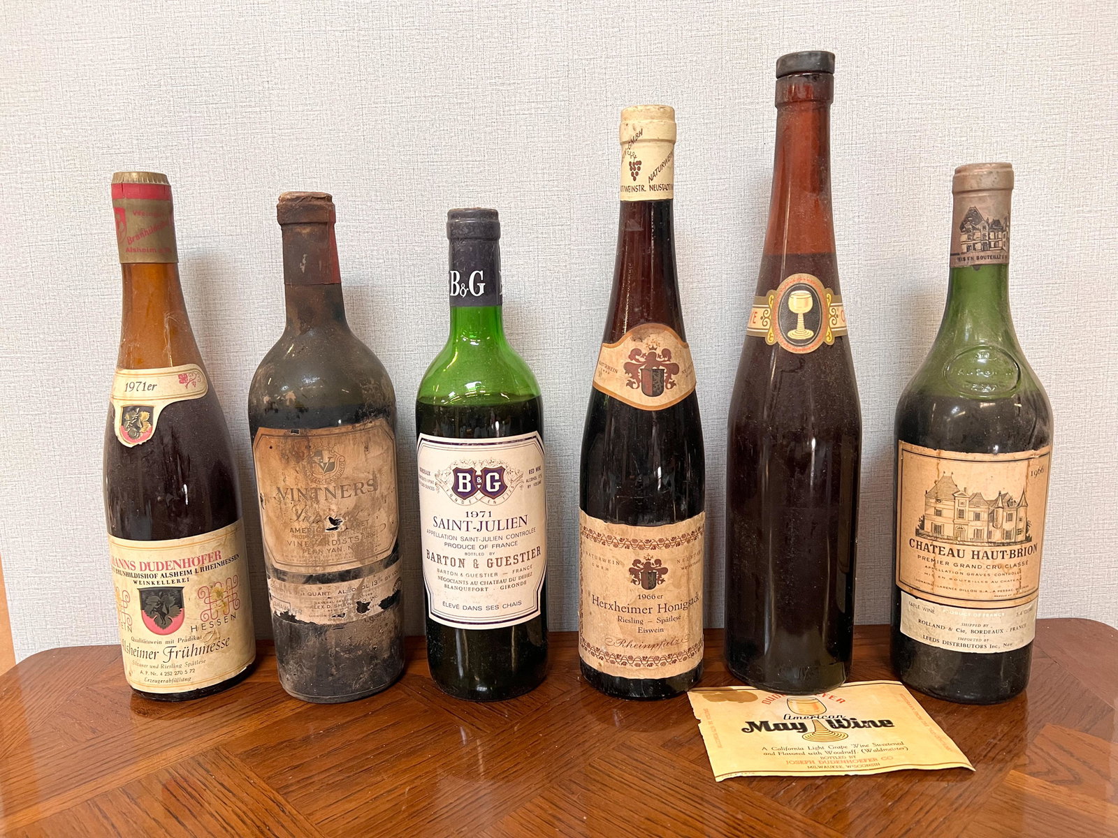 6 Vintage Estate Bottles of Wine Spirits Assorted: Hanns Dudenhofer 1971; Vintners Superior; Barton & Guestier Saint Julien 1971; Herxheimer Honigsack 1966; Dudenhoefer May Wine (detached label); Chateu Haut-Brion 1966 Domestic Shipping: Please Inquir