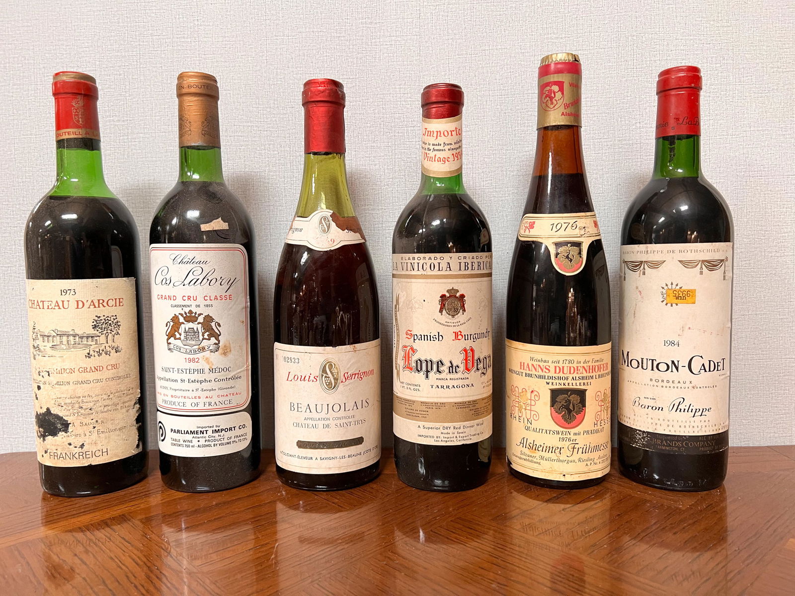 6 Vintage Estate Bottles of Wine Spirits Assorted: Chateau D'Arcie 1973; Chateau Cos Labory 1982; Louis Serrignon 1969; Lope de Vega Tarragona 1959; Hanns Dudenhofer 1976; Baron Philippe Mouton Cadet 1984; Domestic Shipping: Please Inquire