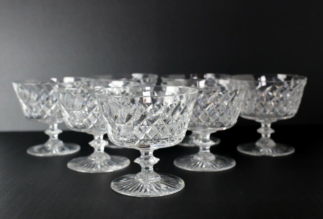 7pc Set of Thomas Webb Cut Glass Sherbet Compotes cross hatch and leaf cuts: 7pc Set of Thomas Webb Cut Glass Sherbet Compotes, cross hatch and leaf cuts, c1950. Etched makers mark on base. 6.75lb Approx. Measurements: 4.375 in height x 4.5 in diameter at rim. Domestic Shippin