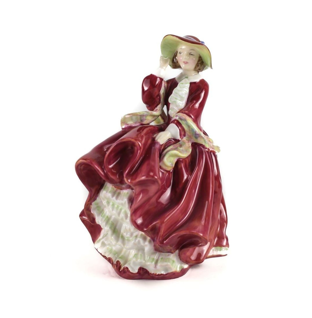 Royal Doulton Hand Painted Porcelain Figurine 'Top O' The Hill' HN 1834: Royal Doulton Hand Painted Porcelain Figurine 'Top O' The Hill' HN 1834. A beautiful young lady in a deep red full length gown and bonnet with a yellow scarf catching her billowing skirt. Marked to th