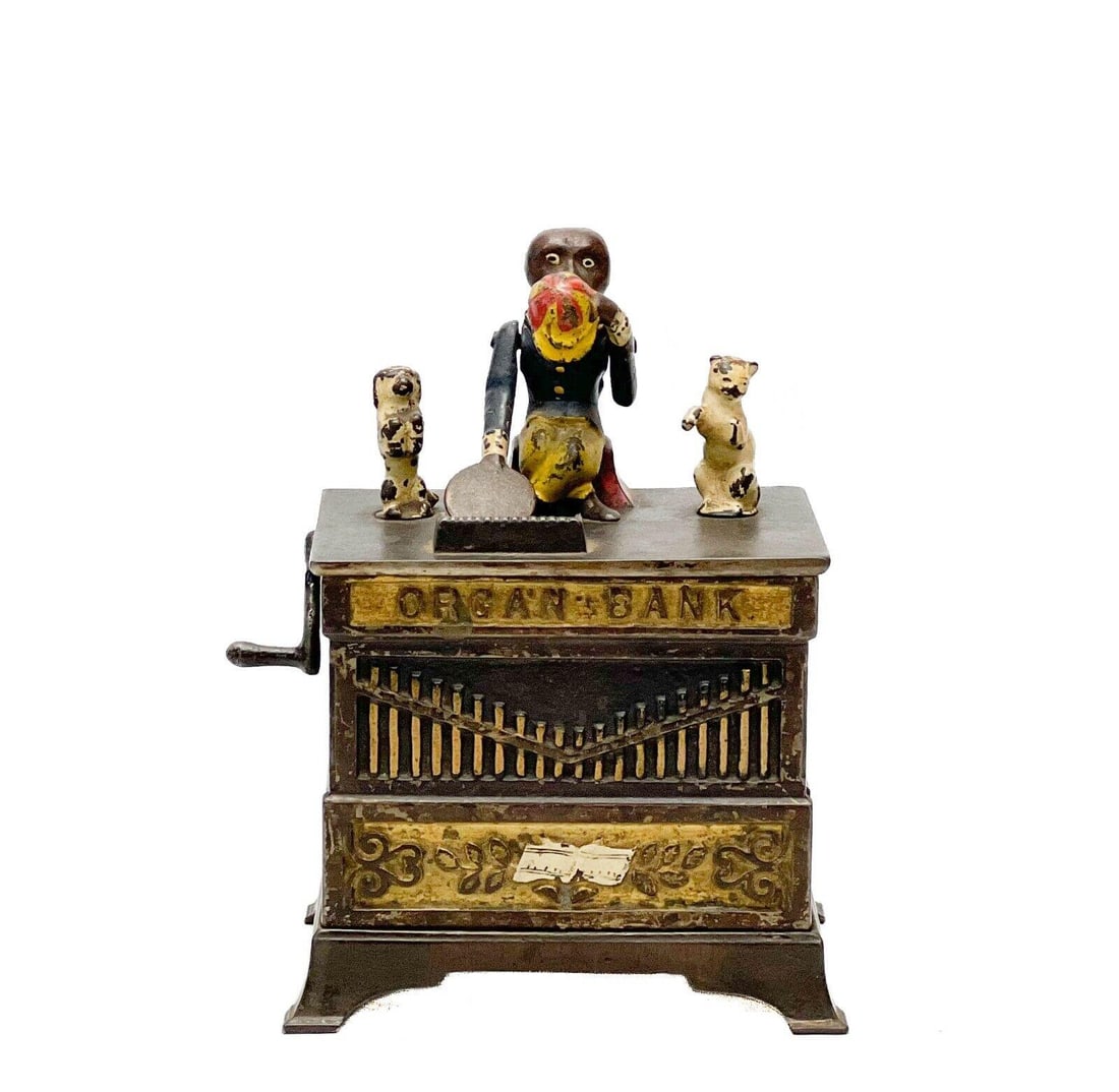 Ksyer & Rex Cold Painted Cast Iron Organ's Bank Mechanical Bank Monkey Dog & Cat: Ksyer & Rex cold painted cast iron Mechanical Bank Organ's Bank, an early example. Monkey, cat and dog to the top. Back marked Pat June 18 1882. When the lever is turned, the dog and cat rotate and th