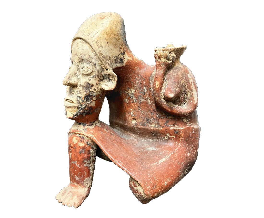 Pre Columbian Jalisco Kneeling Female Figurre with Bowl: Pre Columbian Jalisco Kneeling Female Form with Bowl. Large head resting on knee. White and red slip. 8.3lb Measures Approx.11.75 inches height x 9 in wide x 8.75 in deepDomestic Shipping: $60