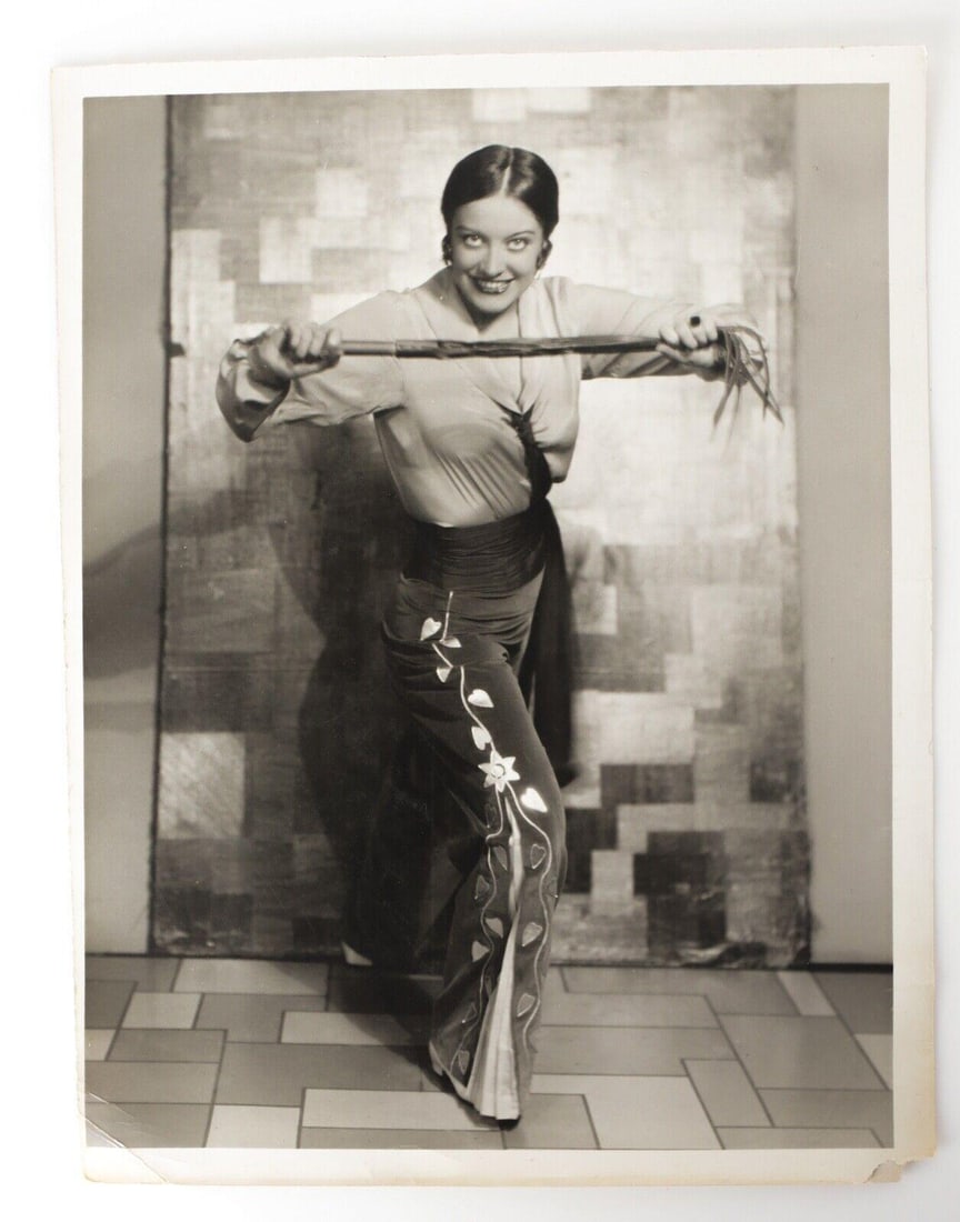 Rare Photograph Joan Crawford c1930 Publicity or promotional photo 10x13: Silver Gelatin Photograph Joan Crawford, c1930, Publicity or promotional photo, dressed in spanish or mexican pants and holding a whip. Approx. Measurements: 10" x 13" Condition: Very Good condition, 