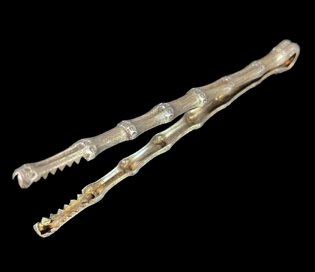 Janna Thomas de Velarde Sterling Silver bamboo form tongs: Janna Thomas de Velarde Textured Sterling Silver 'bamboo' tongs, serrated teeth, makers mark and marked sterling Mexico No. 45865.47grams; 7.5 x 1.5 x 0.5 inches Domestic Shipping: $30