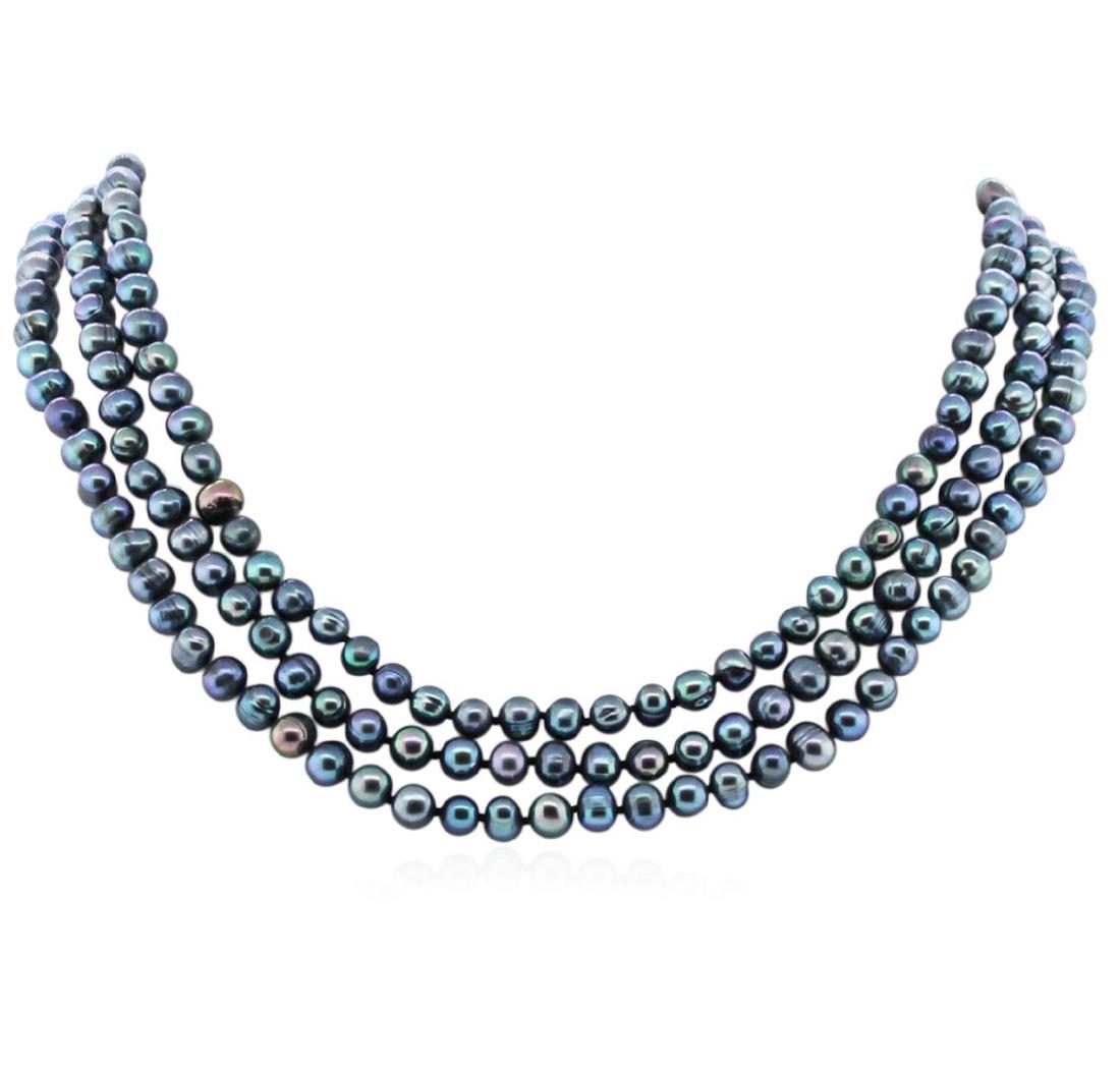 6.5-7.5MM Dark Coral Pearl Necklace: One dark coral pearl necklace approximately 60" long. The pearls measure approximately 6.5-7.5mm. Good condition.