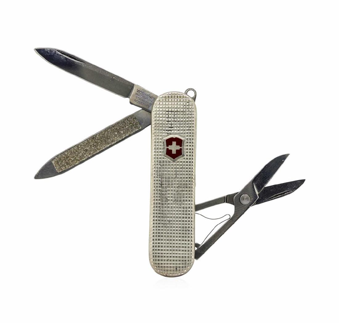 Sterling Silver Swiss Army Knife: One Sterling Silver Swiss Army Knife.