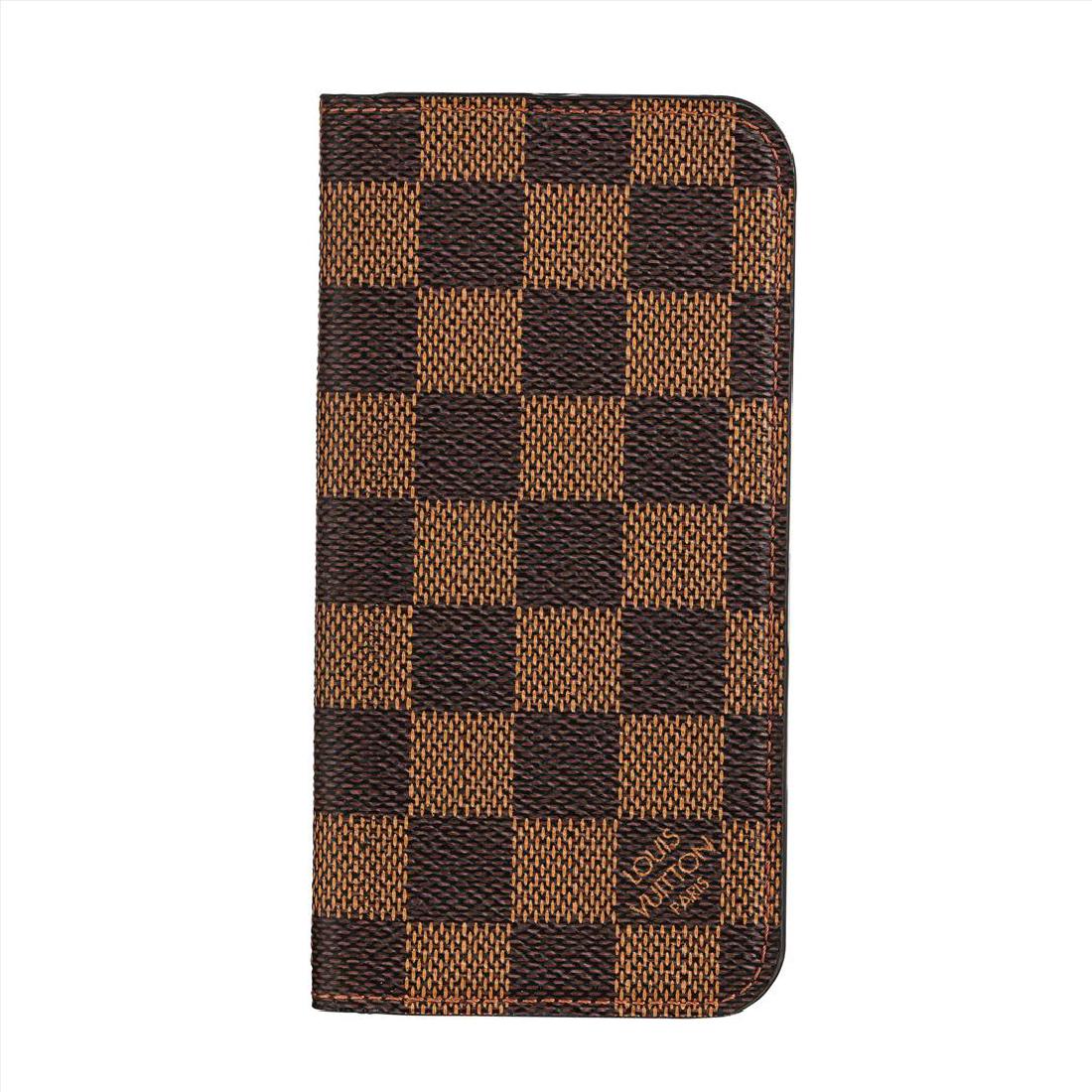 Louis Vuitton Damier Ebene iPhone 6 Case: Authentic Louis Vuitton iPhone 6 Folio Case in historic and iconic Damier Ebene canvas. This phone case is in good used condition. The functional adhesive surface has been used before but still works.