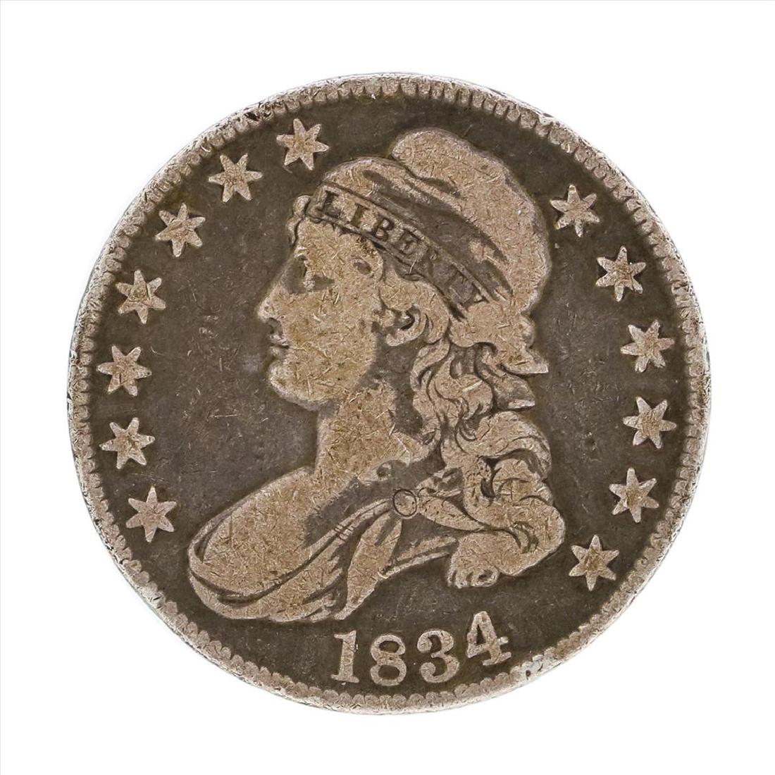 1834 Capped Bust Half Dollar Coin: One 1834 Capped Bust Half Dollar Coin.
