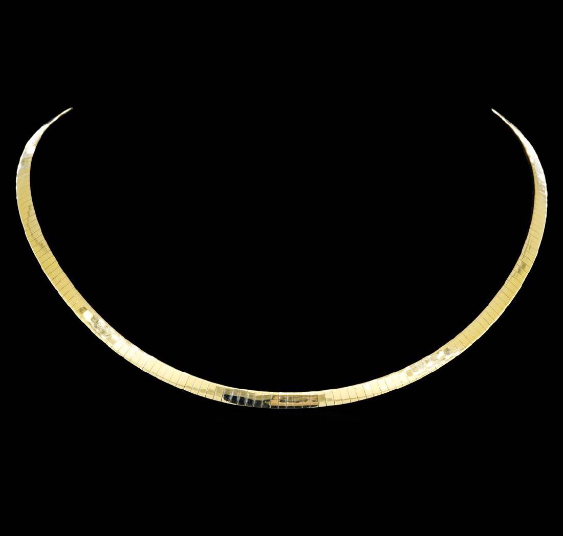 14KT Yellow Gold Omega Necklace: One Ladies omega necklace featuring: 14KT yellow gold weighing 26.6 grams.