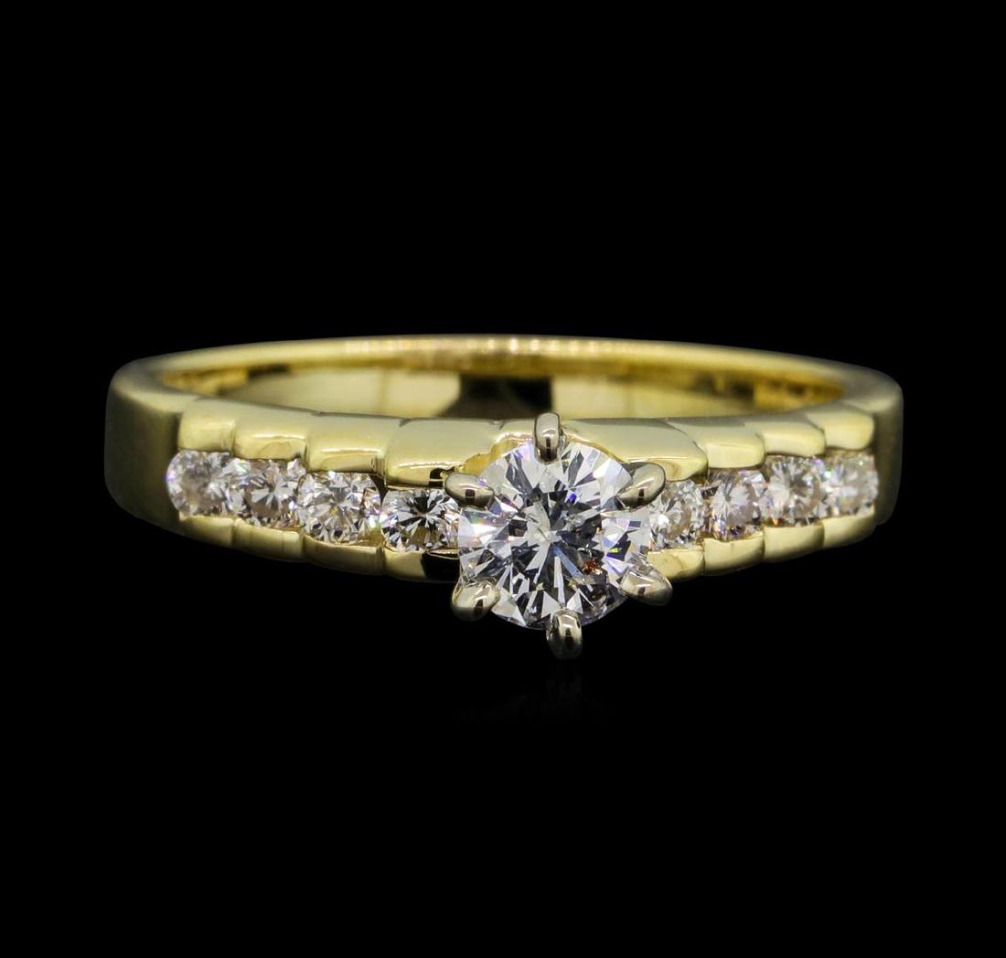14KT Yellow Gold 0.57ctw Diamond Ring: One electronically tested 14KT yellow gold lady's combination cast & assembled wedding ring with a bright polish finish. The featured lady's ring has a shank measuring 2.30 millimeters wide. Identifie