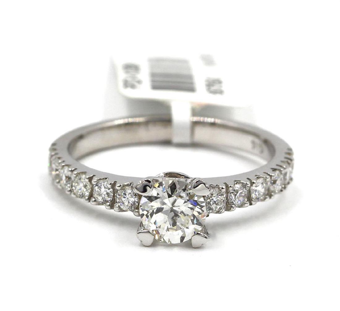 14KT White Gold 1.06 ctw Round Cut Diamond Engagement: One Round Cut Diamond Solitaire with Accent Engagement Ring in 14k White Gold. Setting style is solitaire with diamond setting. Total carat weight is 1.06 carats. Gross weight is 2.82 grams. Total of 