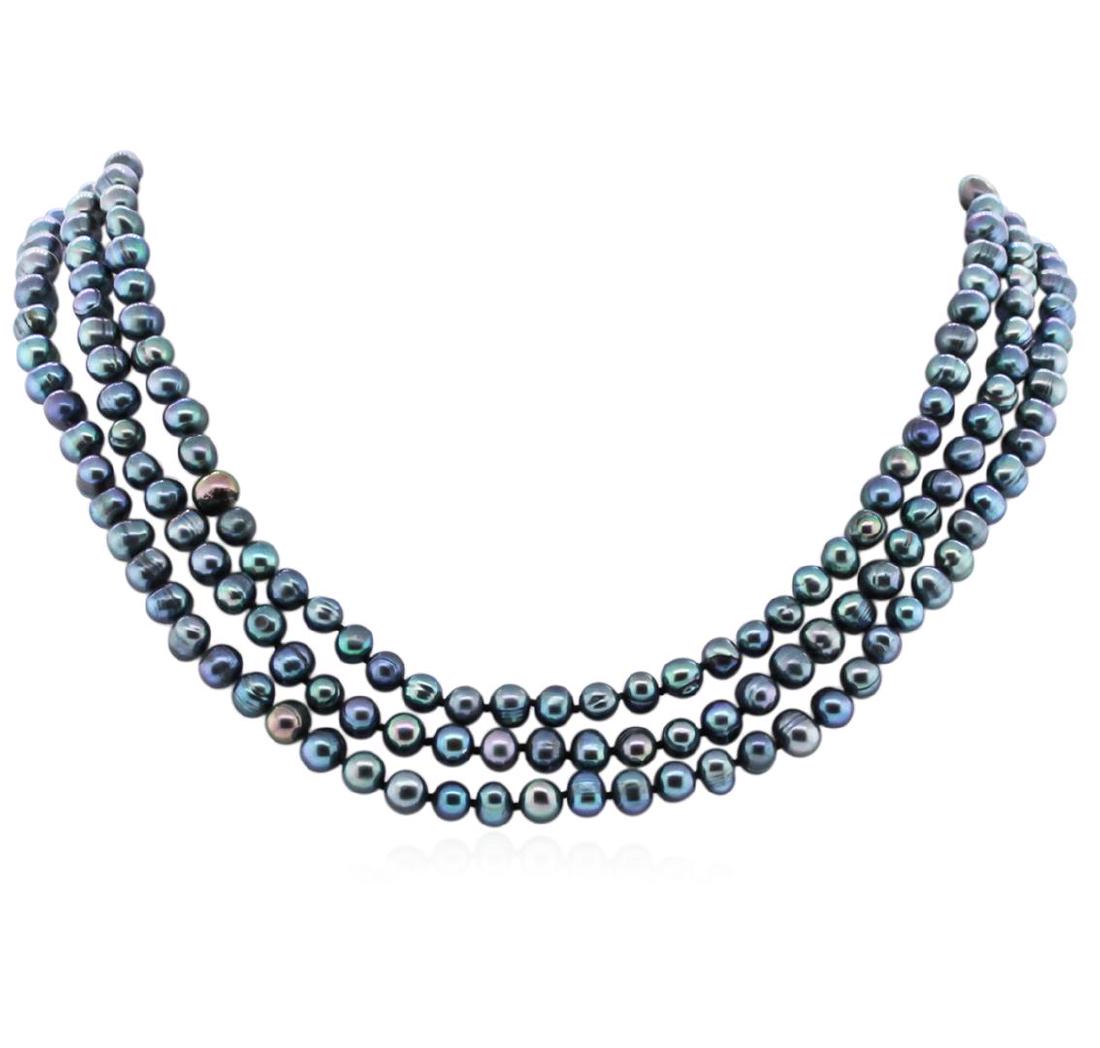 6.5-7.5MM Dark Coral Pearl Necklace: One dark coral pearl necklace approximately 60" long. The pearls measure approximately 6.5-7.5mm. Good condition.