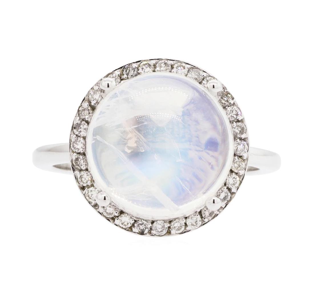 14KT White Gold Lady's 7.32 ctw Moonstone and Diamond: One lady's ring featuring: 14KT white gold weighing 4.7 grams containing one moonstone weighing 7.32ct and diamonds weighing 0.32ctw. The ring is a size 6.25.