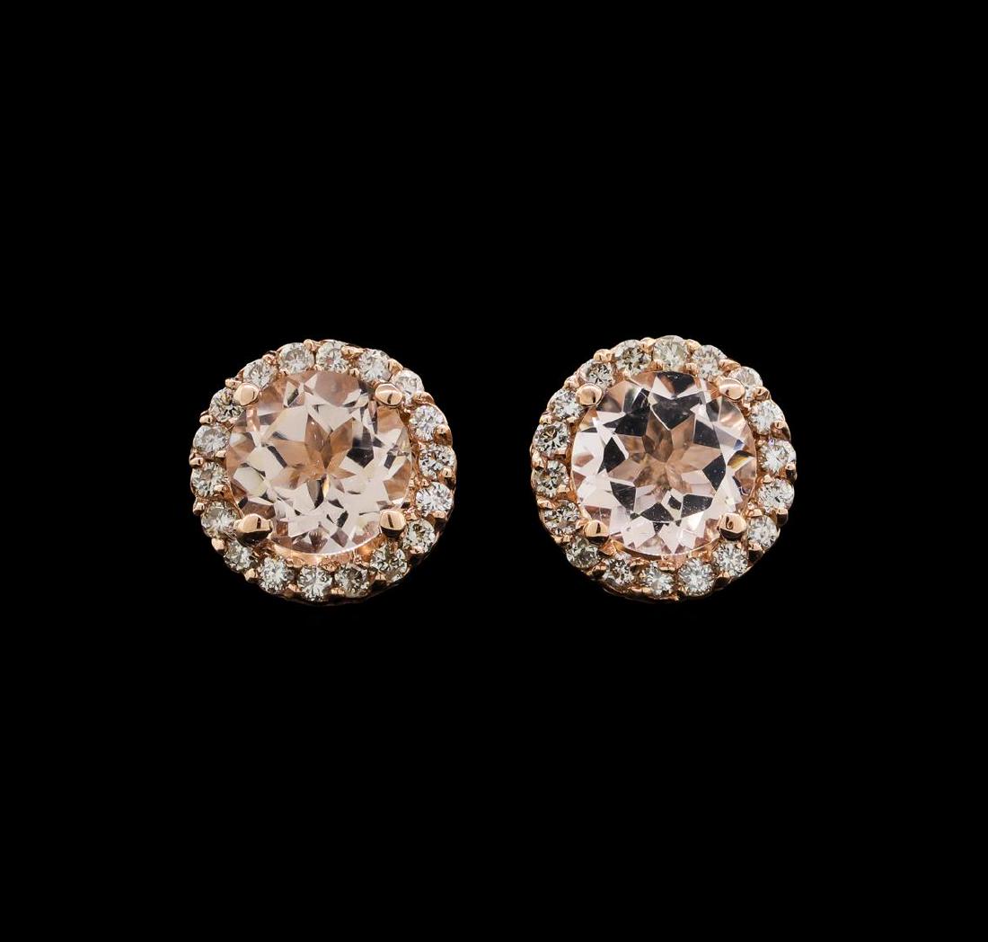 14KT Rose Gold 1.54 ctw Morganite and Diamond Earrings: One pair of lady's earrings featuring: 14KT rose gold weighing 1.8 grams containing two morganites weighing 1.54ctw and diamonds weighing 0.29ctw.
