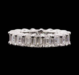 14KT White Gold 7.65 ctw Diamond Eternity Band: One electronically tested 14KT white gold lady's cast eternity band with a bright polish finish. The featured lady's ring has a shank measuring 5.70 millimeters wide. Identified with markings of "14K"