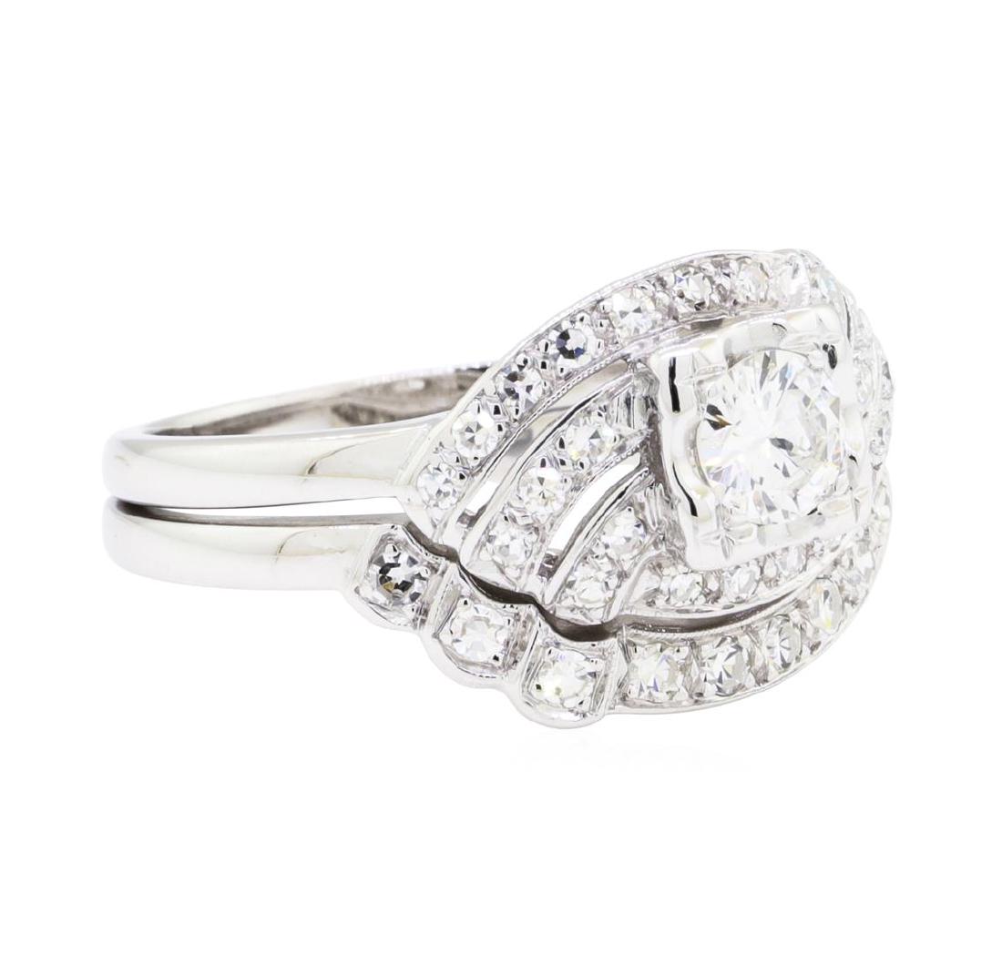 14KT White Gold 0.72 ctw Diamond Ring: One set electronically tested 14KT white gold lady's combination cast & assembled wedding ring soldered to wedding band with a bright polish with milgrain detailing finish. The featured lady's ring ha